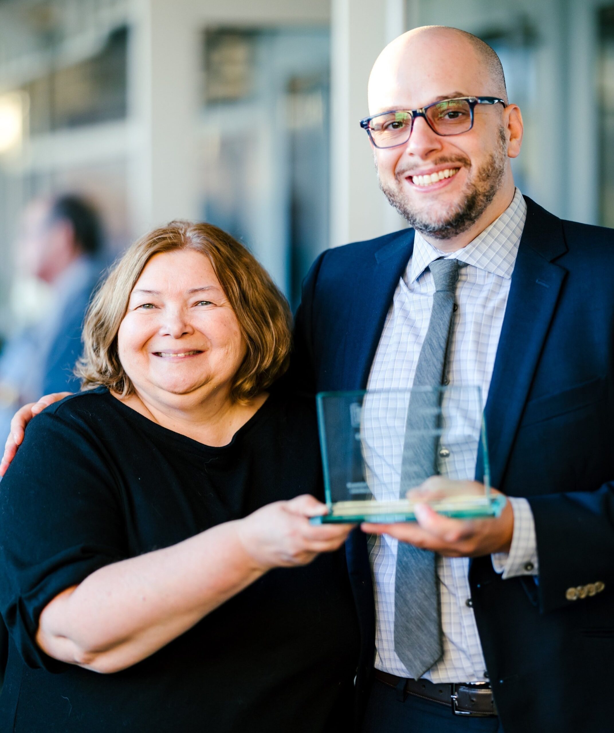 Michael Davis and MaryBeth Heydt accepting the CLA Diversity Award on behalf of DTO Law