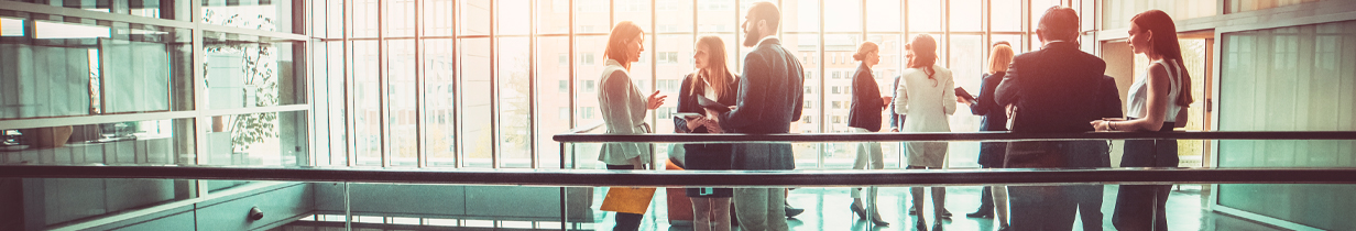 Group of people standing in a lobby