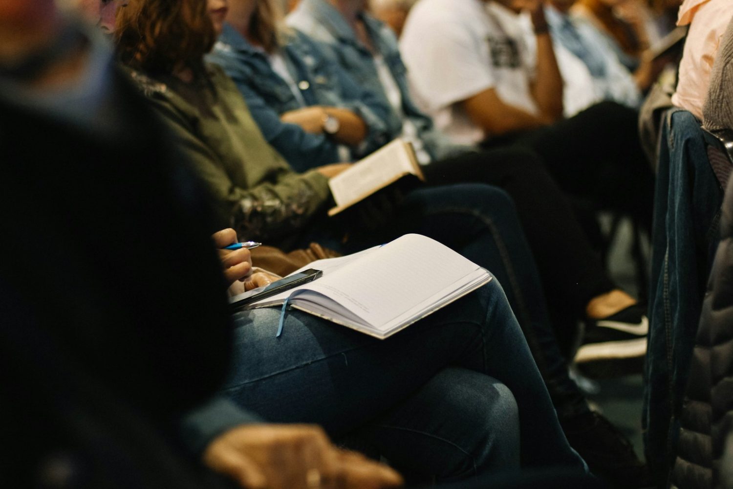 woman taking notes in a journal