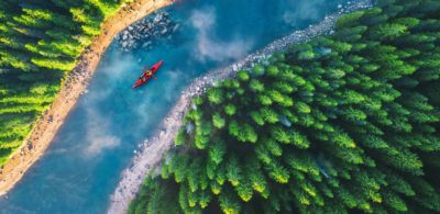 Kayak, river with rocks and trees.
